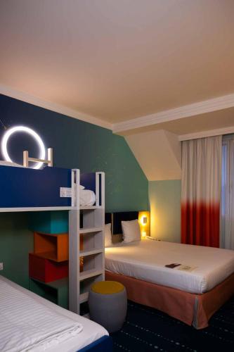Habitación Familiar del hotel Grand Magic Hotel Marne La Vallée. Foto 12