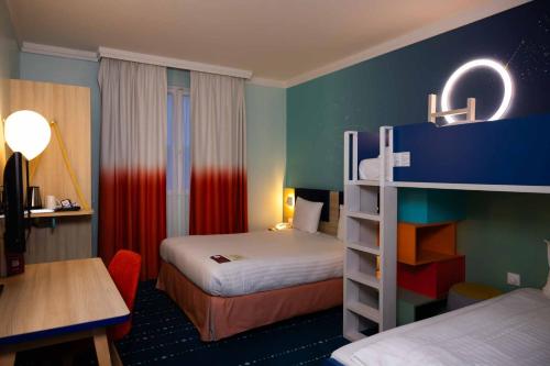 Habitación Familiar del hotel Grand Magic Hotel Marne La Vallée. Foto 13