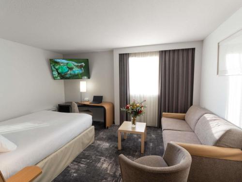Habitación Ejecutiva - 1 cama doble y 1 sofá - cama del hotel Novotel Centre Nantes Bord De Loire. Foto 1