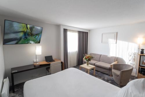Habitación Ejecutiva - 1 cama doble y 1 sofá - cama del hotel Novotel Centre Nantes Bord De Loire. Foto 7