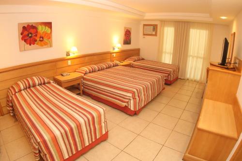Habitación Cuádruple Estándar del hotel Atlantico Buzios Convention and Resort. Foto 4