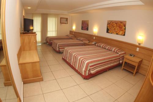 Habitación Cuádruple Super Deluxe con vistas al mar del hotel Atlantico Buzios Convention and Resort. Foto 4
