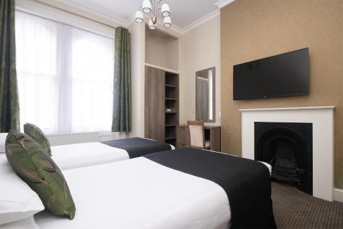 Habitación Doble con baño privado - 2 camas del hotel Kensington Gardens. Foto 1