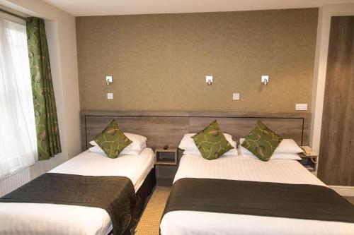 Habitación Triple del hotel Kensington Gardens. Foto 3