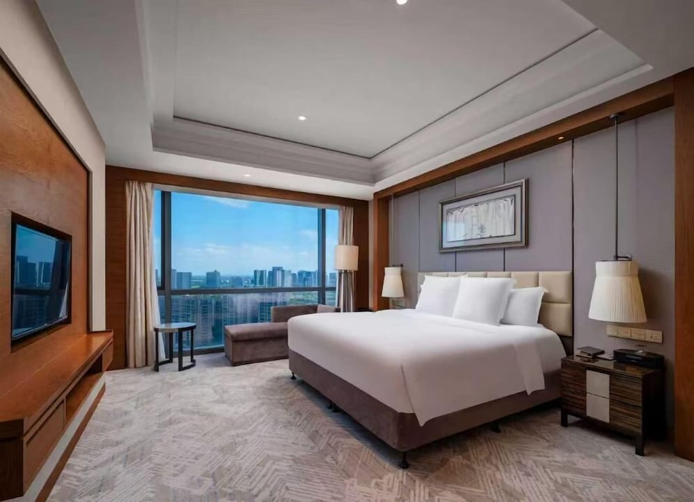 Habitación Deluxe, 1 cama de matrimonio grande del hotel Pullman Haining. Foto 1