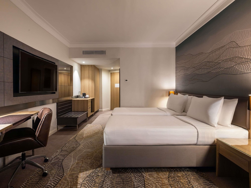 Habitación Premier con 2 camas individuales del hotel Novotel Kuala Lumpur City Centre. Foto 1