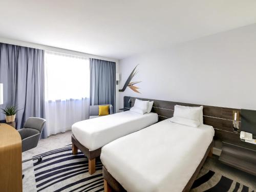 Habitación Twin Clásica - 2 camas individuales del hotel Novotel Paris Centre Gare Montparnasse
