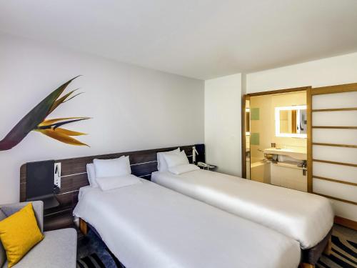 Habitación Twin Clásica - 2 camas individuales del hotel Novotel Paris Centre Gare Montparnasse. Foto 5