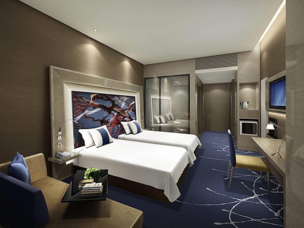 Habitación Premier con 2 camas individuales, Piso Premier del hotel Novotel Ningbo East. Foto 1