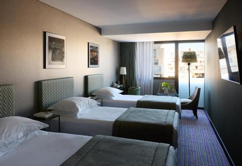3 Single Classic Triple City View Room del hotel President. Foto 2