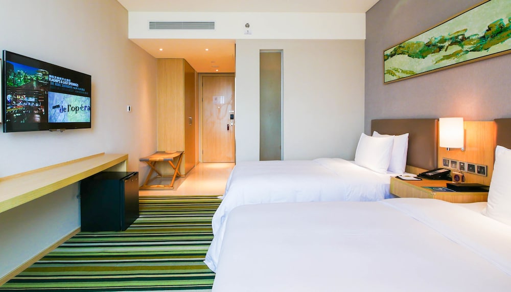 Habitación estándar con dos camas individuales del hotel Mercure Nanchang Sunac. Foto 2