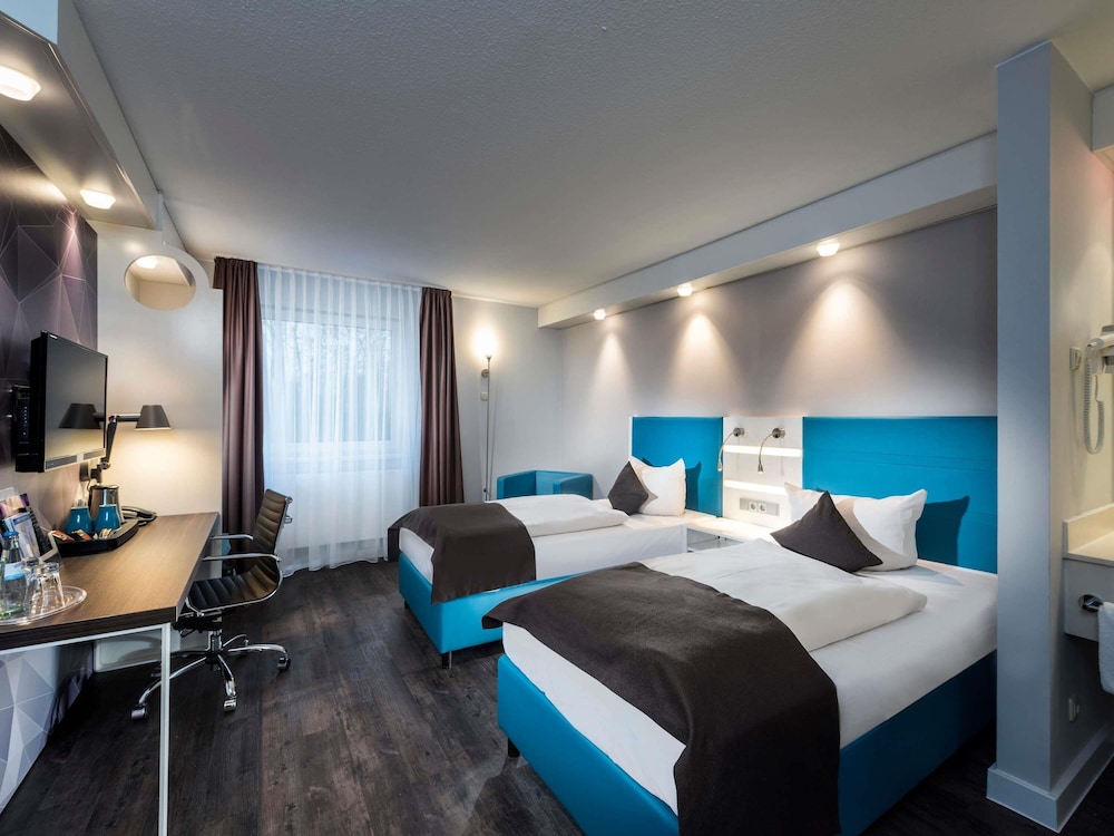 Habitación estándar con 2 camas individuales del hotel Ibis Styles Cologne Airport. Foto 3
