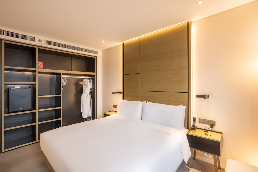 Estudio con vistas a la ciudad del hotel Innside Zhengzhou. Foto 4