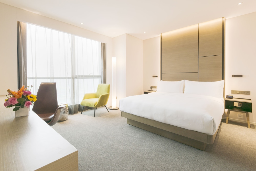 Loft con vistas a la ciudad del hotel Innside Zhengzhou. Foto 1