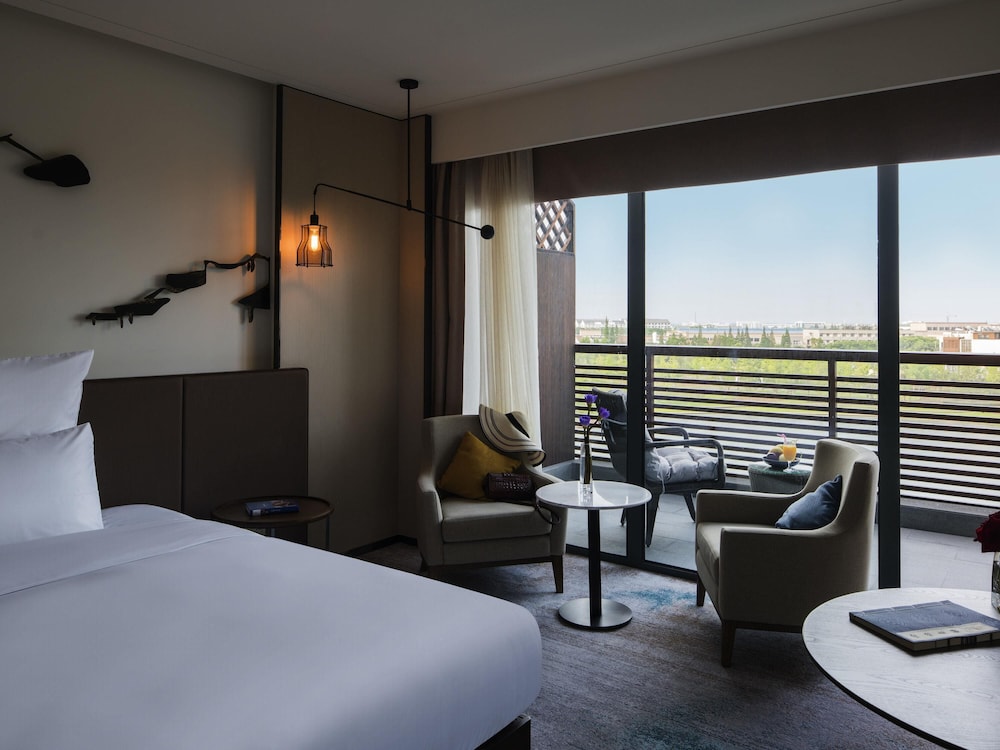 HABITACIÓN DELUXE EJECUTIVA, BENEFICIOS DEL SALÓN, DOS CAMAS INDIVIDUALES, VISTAS AL PARQUE del hotel Pullman Zhouzhuang