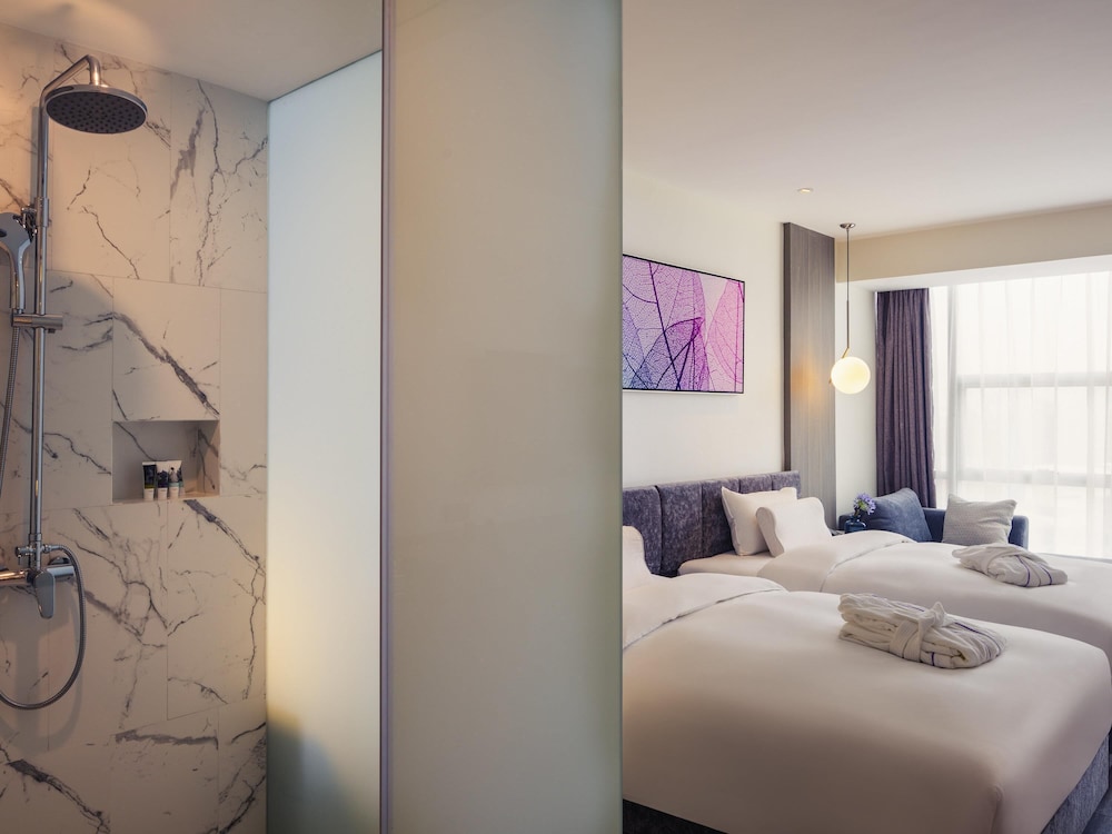 Habitación superior con 2 camas individuales del hotel Mercure Shanghai Hongqiao South. Foto 2