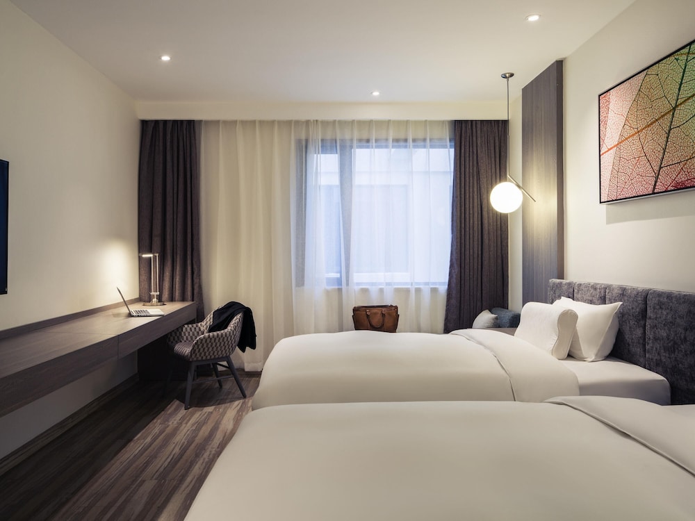 Habitación Deluxe con 2 camas individuales del hotel Mercure Shanghai Hongqiao South. Foto 2