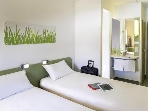 Habitación Doble Estándar - 2 camas del hotel Ibis Budget Nuernberg City Messe. Foto 1