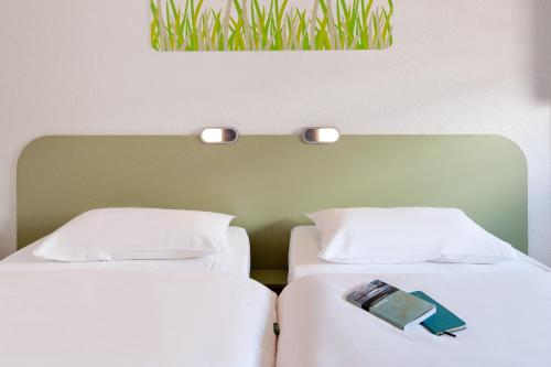 Habitación Doble Estándar - 2 camas del hotel Ibis Budget Nuernberg City Messe. Foto 5