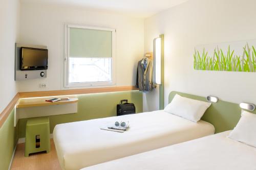 Habitación Doble Estándar - 2 camas del hotel Ibis Budget Nuernberg City Messe. Foto 7