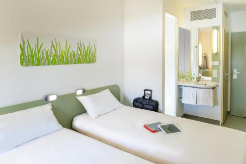 Habitación Doble Estándar - 2 camas del hotel Ibis Budget Nuernberg City Messe. Foto 8