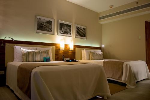 Habitación Doble Deluxe del hotel Emporio Cancun. Foto 1