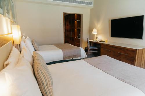 Habitación Deluxe del hotel Emporio Cancun. Foto 1