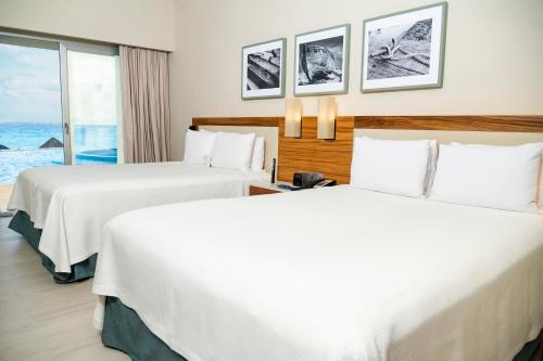 Habitación Doble con acceso directo a la piscina - Frente al mar - Solo adultos del hotel Emporio Cancun. Foto 6