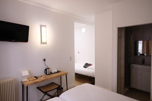 Habitación Triple del hotel L'amiral. Foto 2