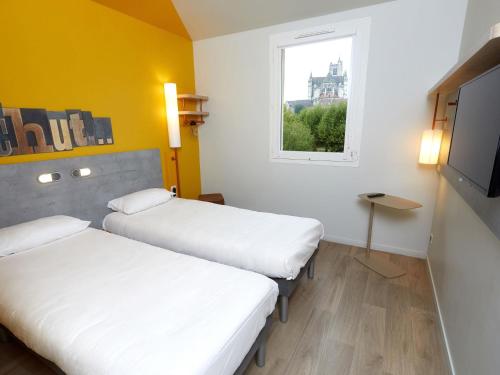 Habitación con dos camas individuales del hotel Ibis Budget Auxerre Centre