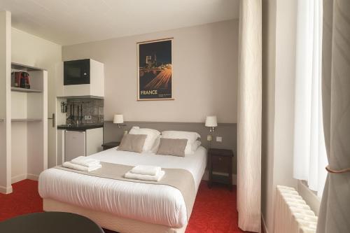 Habitación Doble con zona de cocina del hotel Du Parc Montsouris. Foto 1