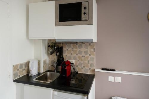 Suite Familiar con cocina americana del hotel Du Parc Montsouris. Foto 1