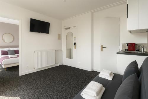 Suite Familiar con cocina americana del hotel Du Parc Montsouris. Foto 3