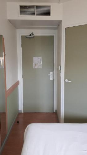 Habitación Triple del hotel Ibis Budget St Gratien - Enghien-les-bains. Foto 1