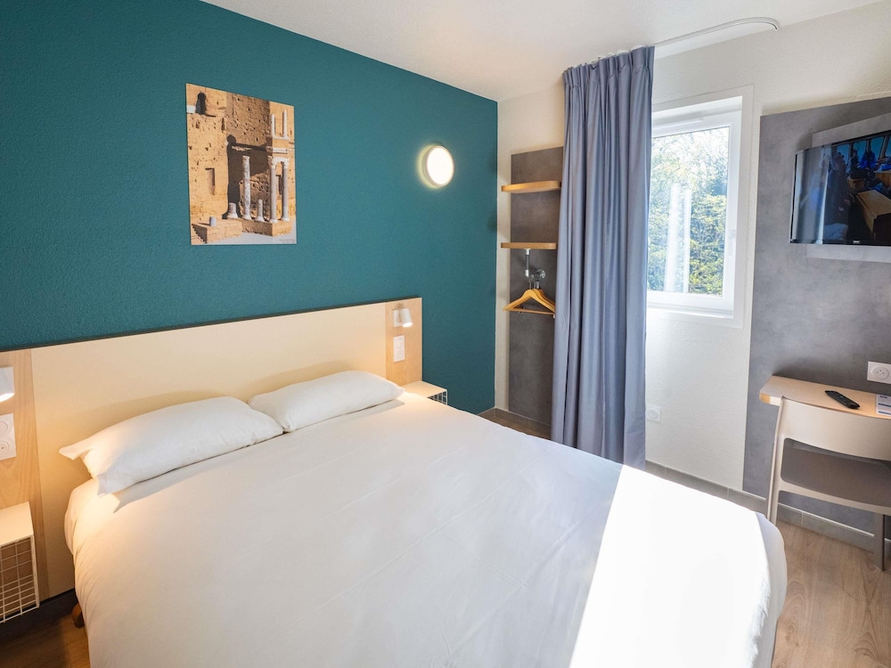 Habitación Standard con una cama doble del hotel Ibis Orange Centre Echangeur A7 A9. Foto 3