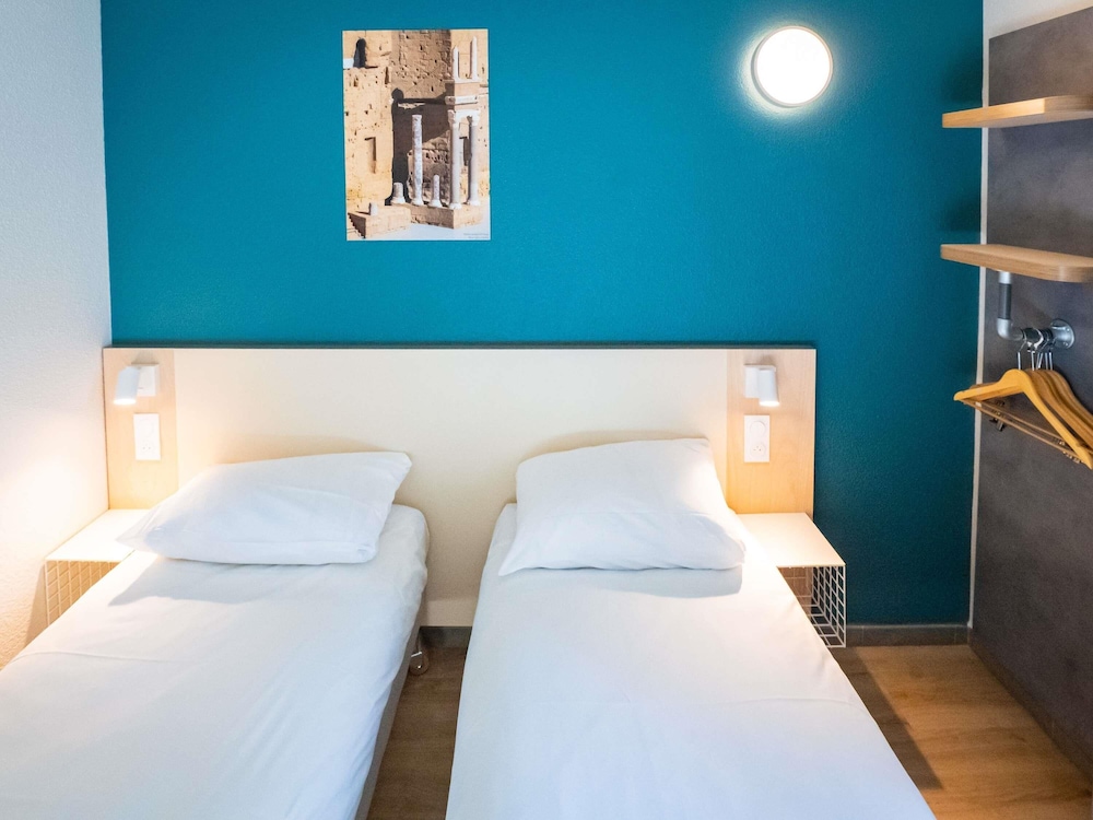 Habitación Standard con dos camas individuales del hotel Ibis Orange Centre Echangeur A7 A9. Foto 2
