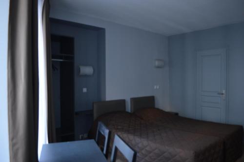 Habitación Triple del hotel Hôtel Alléty. Foto 16