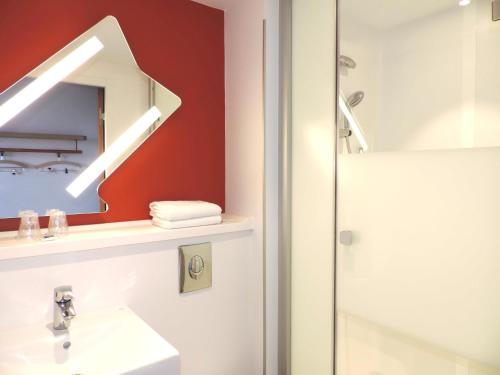 Habitación Triple con camas individuales del hotel Ibis Budget Amiens Centre Gare