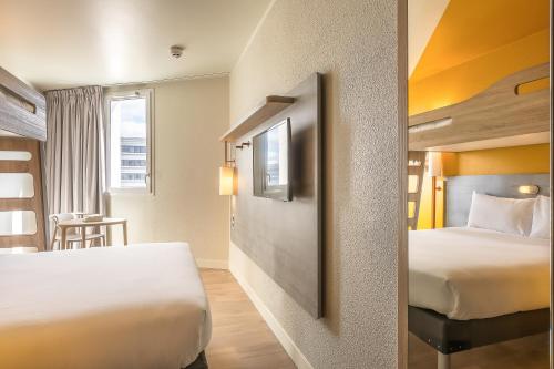 Habitación Triple del hotel Ibis Budget Paris Gennevilliers. Foto 7