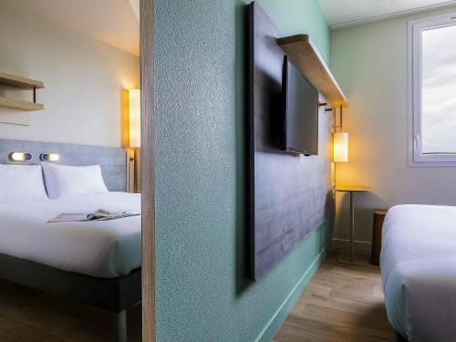 Habitación Doble del hotel Ibis Budget Paris Gennevilliers. Foto 2