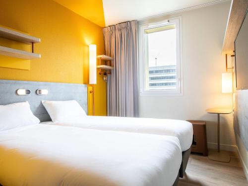 Habitación Doble - 2 camas del hotel Ibis Budget Paris Gennevilliers. Foto 3