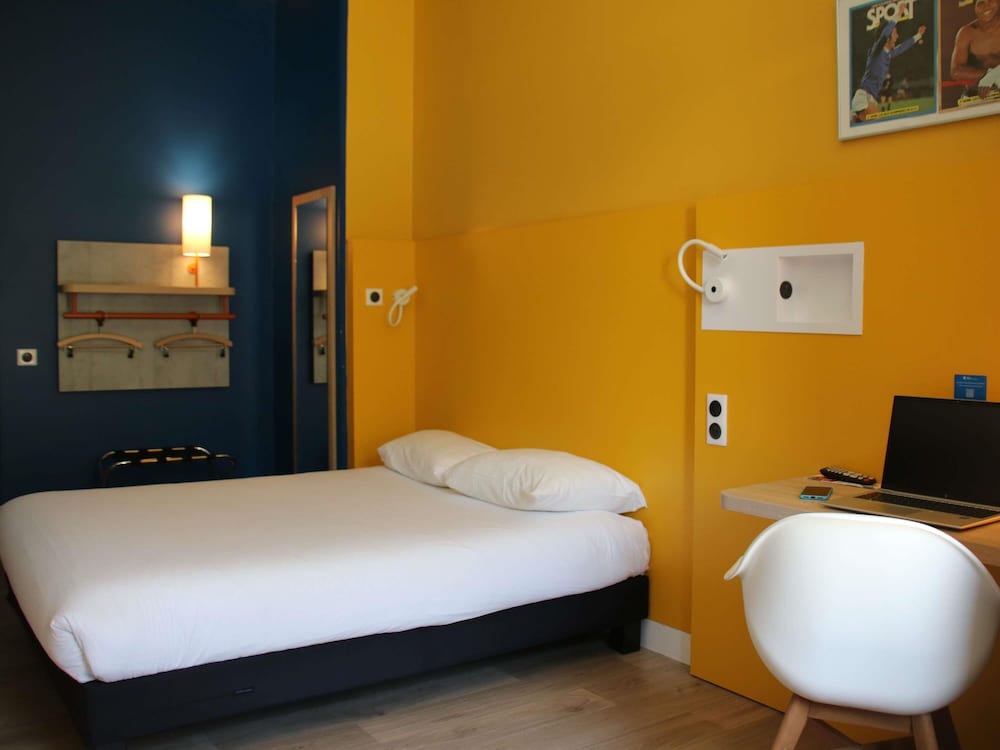 Habitación, varias camas, accesible para personas con discapacidad del hotel Ibis Budget Rennes Route De Lorient. Foto 5