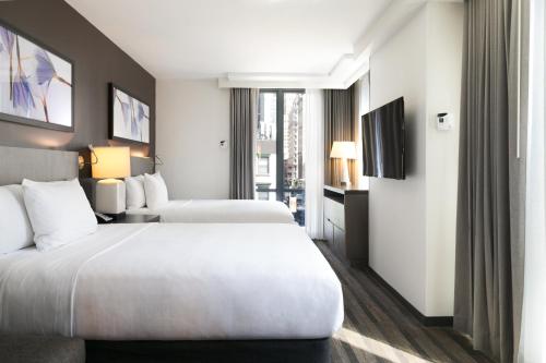 Habitación Den con 2 camas grandes del hotel Hyatt House New York/chelsea. Foto 1