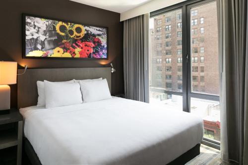 Habitación Den con cama extragrande del hotel Hyatt House New York/chelsea