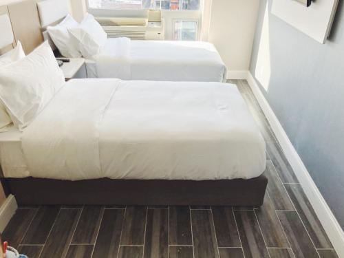 Habitación Doble Estándar - 2 camas individuales del hotel Mayflower Boutique. Foto 1