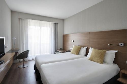 Habitación Doble Básica del hotel Vincci Zentro Zaragoza. Foto 1