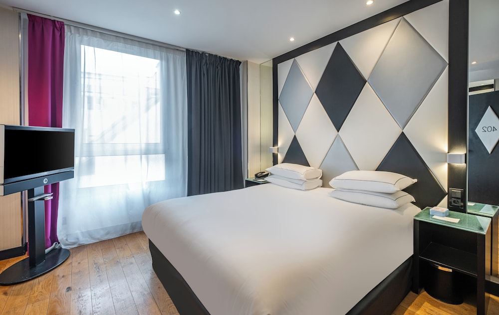 Habitación superior del hotel L'Empire Paris. Foto 1