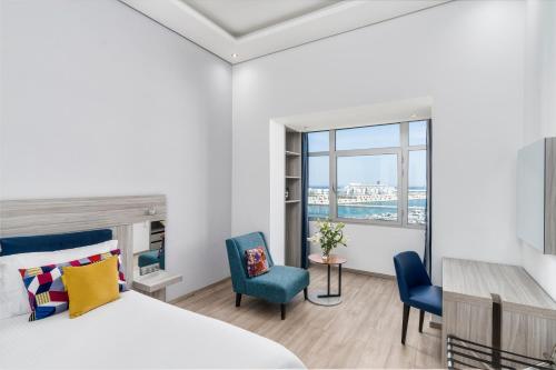 Habitación Legend - Vista al puerto deportivo del hotel Marina Bay City Center