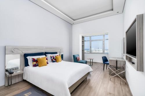 Habitación Legend - Vista al puerto deportivo del hotel Marina Bay City Center. Foto 4