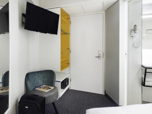 Habitación Individual Estándar del hotel Ibis Styles Amsterdam Central Station. Foto 3